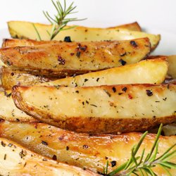 Cartofi wedges garlic and herbs image