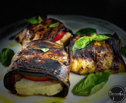 Grilled aubergine with feta & tomatoes image